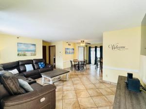 a living room with a couch and a table at Put-in-Bay Poolview Condo #4 in Put-in-Bay