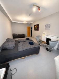 a bedroom with a bed and a desk and a fireplace at Freedom Studio Apartment in Berlin