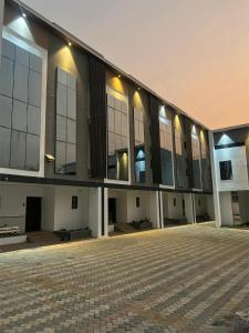 a large building with a lot of windows at Leria Living luxury 2 bedroom wuye, Abuja in Ankuru
