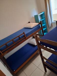 a bedroom with two bunk beds in a room at Apartamentos Gratitude in Ubatuba +30 photos