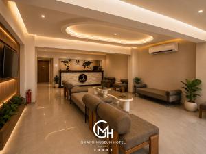 a waiting room with couches and a fireplace at Grand Museum Hotel Giza in Cairo