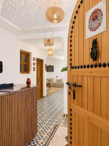 an open door in a room with a kitchen at Riad Le Sultan Rouge And Spa in Marrakesh