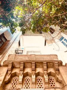 an overhead view of a building with a tree at Per-en in Cairo