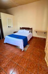 a bedroom with a large bed in a room at Accommodation #7 in Copán Ruinas +6 photos