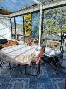 a room with a table and a motorcycle in it at Continental Aparta Hotel Duitama in Duitama