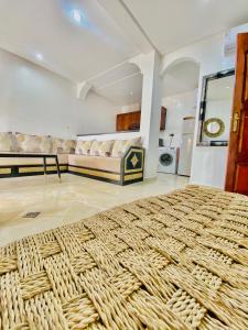 a large room with a bed and a couch at Agadir City Appartement in Agadir