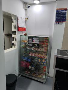 a store with a display case filled with food at Continental Aparta Hotel Duitama in Duitama