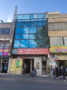 a building on the corner of a city street at Continental Aparta Hotel Duitama in Duitama
