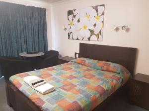 Postel nebo postele na pokoji v ubytování Carnarvon Gateway Motel