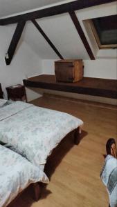 a bedroom with a bed and a wooden floor at Vila Olga in Sombor +13 photos
