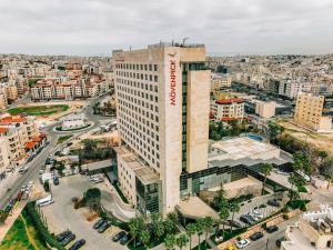 an overhead view of a building in a city at Mövenpick Hotel Amman in Amman