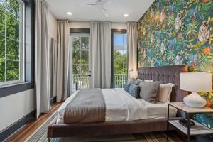 a bedroom with a large painting on the wall at 7BR City Condo & Pool Access Near CBD in New Orleans