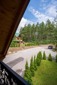 a view from a window of a driveway with christmas trees at Brvnara Mont in Zlatibor
