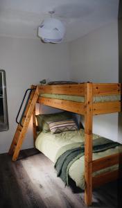 a bunk bed in a room with a wooden bunk bed at Spacious home in Machrihanish in Machrihanish