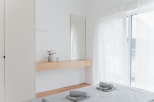 a bedroom with a bed with two towels on it at MiHome - modern Living in Rottenmann +66 photos