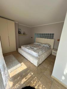 a bedroom with a bed in a room at Apartment golem in Durrës
