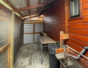 a sauna with a bench and a trash can at Hospedaje Canarias in Pucón