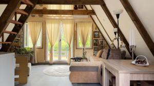 a living room with a couch and a table at Vrela Holiday Home in Cetinje