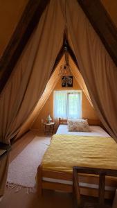 a bedroom with a bed in a tent at Vrela Holiday Home in Cetinje