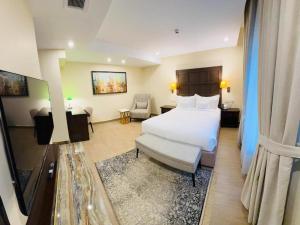 a hotel room with a bed and a couch at Pak Hospitality in Islamabad