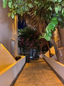 a hallway with trees and plants in a building at Ydora Luxury Hotel in Bodrum City