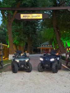 two atvs parked under a sign that reads royal hawaiian island at Royal Ranch Nature Resort in Orhei +58 photos