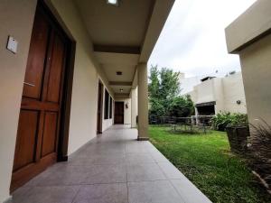 an empty hallway of a building with a door at Hotel Urbana in Córdoba