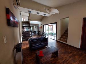 a living room with a couch and a table at Hotel Urbana in Córdoba