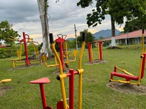 a group of playground equipment in a park at El Rincón del Sol y Luna in Quimbaya