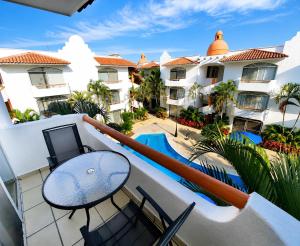 a view of the pool from the balcony of a hotel at Dpto Exclusive Ixtapa in Ixtapa