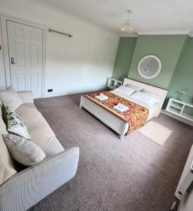 a living room with a bed and a couch at Central Stay in Southampton +4 photos