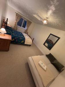 a bedroom with two beds and a window at Central Stay in Southampton