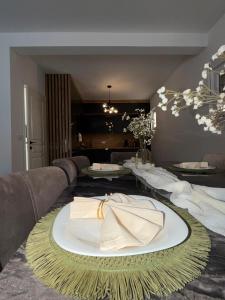 a table with a plate with a napkin on it at AD Homes in Ravanj