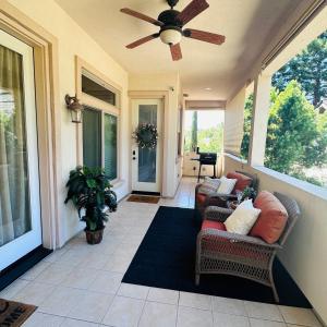 a porch with two chairs and a ceiling fan at Private Master suite with Sauna and Bathtub in Fair Oaks