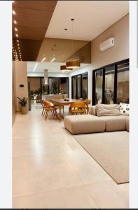 a living room with a couch and a table at Casa lunar in Belfort Roxo