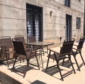 a group of chairs and tables on a patio at Prime Elgon View 5BR Family Home Private Secure in Eldoret