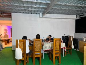 a group of people sitting at a table at WLA Homestay in Labuan Bajo