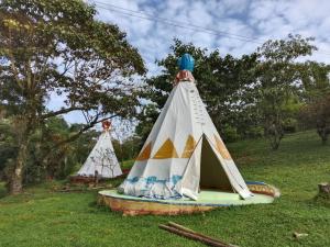a model of a teepee in the grass at Tipis Cuetzalan in Cuetzalán del Progreso
