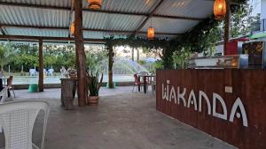 a patio with a table and chairs and a fountain at Finca campestre Wakanda in Doradal