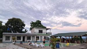 a house with a swimming pool next to a building at Finca campestre Wakanda in Doradal +8 photos
