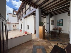 a large outdoor patio with a table and chairs at Casa Lavinia in São Luís