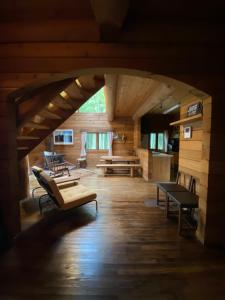 a large room with benches and tables in a cabin at ログbase in Kaga +21 photos