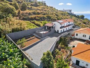 an aerial view of a house on a hill at Casa Afonso Bay Views & Outdoor Living in Funchal