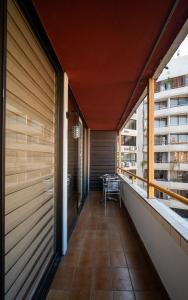 a balcony of a building with a table at Departamentos Providencia J&M in Santiago