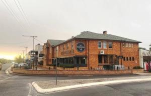 a brick building on the corner of a street at The Gunnedah Hotel in Gunnedah