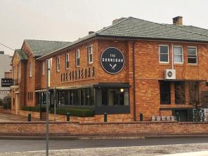 a large brick building with a sign on it at The Gunnedah Hotel in Gunnedah