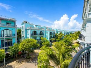 a view of a row of blue apartment buildings at Apple Phu Quoc Hotel & Restaurant in Phú Quốc