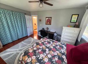 a bedroom with a bed and a desk in it at NinaOCPlace in Ocean City