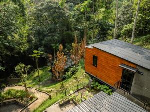an overhead view of a small building in a forest at Mariposa Cabin in Lembang +7 photos