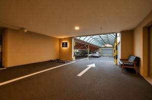 an empty parking lot with a car garage at 경산 에비앙 호텔 in Uksu